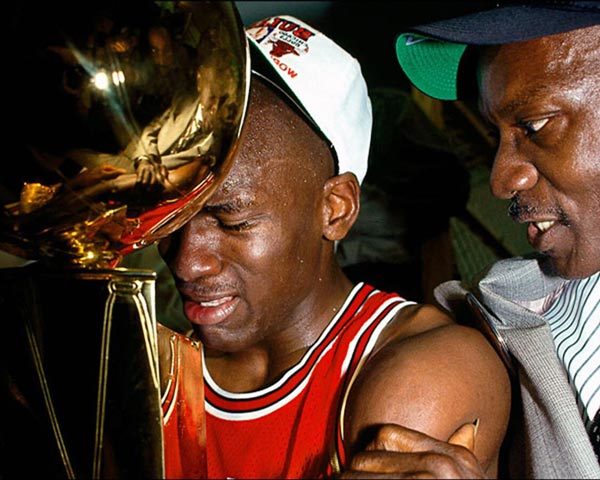 michael jordan hugging championship trophy with his father